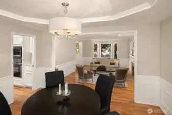 The dining room features a coved ceiling and views to the back yard.