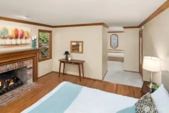 The oversized primary suite also houses a window seat, soaking tub, dual sink and separate tiled shower.