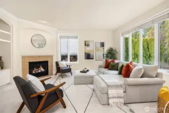 Walls of windows frame tranquil views of the surrounding greenery, bringing the outdoors in and creating a true entertainer’s dream.