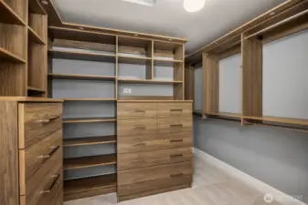 A custom closet system in the primary bedroom keeps everything within reach and organized.