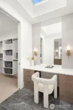 Custom built-in illuminated vanity & 2 oversized walk in closets