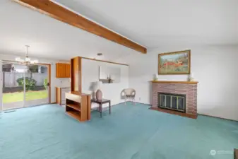 living room with wood burning fireplace