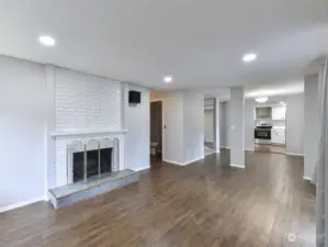 Family Room, 1/2 Bath, Fireplace & Kitchen.