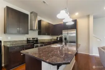 Kitchen with granite countertops and island