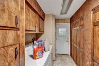 This utility room has SO MUCH STORAGE space! Washer, dryer and freezer included. Access door to carport.