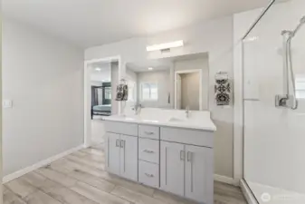 Another view of the Primary bath showcasing the ceramic tile floors that look like wood for that spa-like experience.