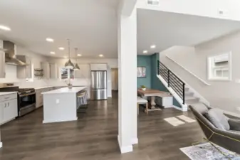 As you enter, the well appointed kitchen & dining with built in banquet, great room to the right.