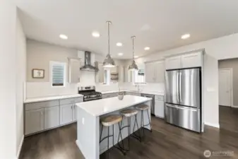 Kitchen with gas range, full tile backsplash.