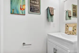 Half bath near primary bedroom door