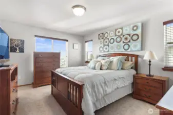 Primary bedroom upstairs with bathroom and walk-in closet
