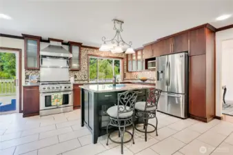 Kitchen Features Large Stove/Oven, Island, Pantry and Stainless-Steel Appliances
