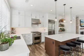 Gourmet kitchen features a Wolff Range, Miele dishwasher and Sub-Zero refrigerator.