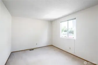 2nd bedroom upstairs is a corner bedroom at the front of the house