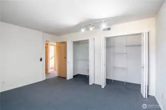 Dual closets in the downstairs bedroom