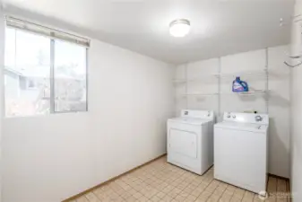 Large laundry room with washer and dryer