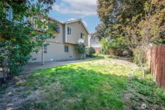 Fully-fenced back yard with great spaces for all your outside activities