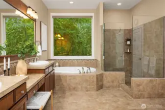 Primary Suite with soaking tub, dual vanities, large shower and grand walk in closet.