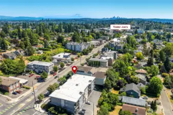 Great Greenwood location with Trader Joes nearby as well as places to grab a bite to eat + shops.  Note the green lines on the street - designated bike path on Greenwood. Also, there's 4 guest parking spots in the back of the complex which is shown in this photo.