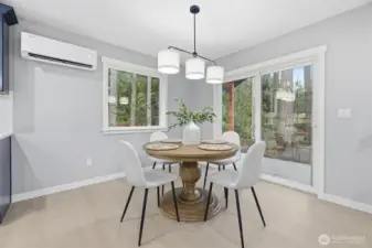 Dining area with slider to the covered patio.