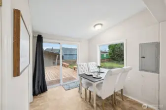 Dining area opens to oversized deck.