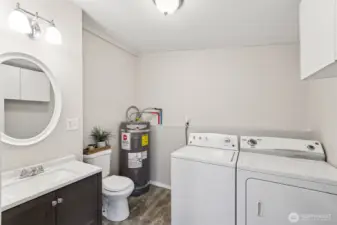 Main level half bathroom and laundry room
