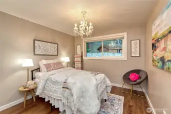 The second bedroom has a West facing window, looking into the back yard and a fresh coat of paint.