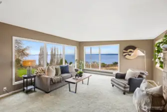 The living room, with the Kingston/Edmonds ferry, marine traffic, and Cascades in the background.