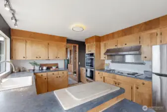 The kitchen, looking towards the doorway into the dining room.  There is a small area behind me with space for a 4-6 person breakfast table.