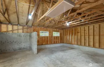 The right side, with welding bay and storage.  There is a sliding barn door that opens int he breezeway directly to the workshop.