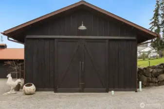 The workshop and garage feature the shou sugi ban” finish with patina on rooftop-what a stunning combination!