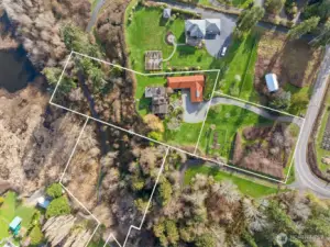 The upper lot is vacant, and the upper left lot has the home, garage, and workshop on it. Note how the property extends down the hillside, giving you control over the vegetation that may grow into the view.  The lower-left lot is deeded common space, giving access to Puget Sound.