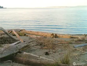 25' of shared common area to Puget Sound's saltwater!  Perfect for picnics, hand-launching boats and kayaks, and a short walk from the house to watch shipping traffic, sunrise and sunset!  Whidbey Island's Sachet Head and Possession bar are in the background.  This property is offered with so maby assets, you don't want to miss it!