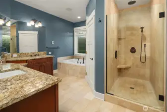 5-piece luxe Primary Ensuite Bath with heated Travertine floors. Travertine floor to ceiling walk-in shower. Dual sinks & built-in vanity station.