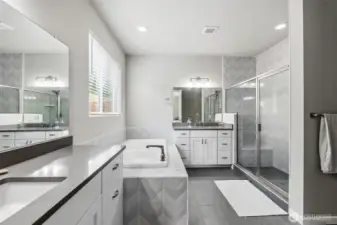 Custom primary bath with tiled flooring