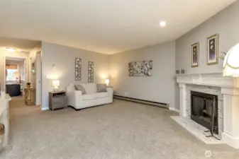 Large living room with cozy fireplace, open layout, and plenty of space for entertaining or relaxing at home.