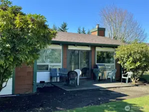 Barbecue patio outside of the clubhouse, overlooking the tennis courts.
