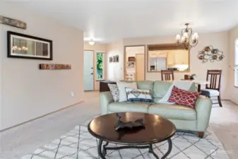 Living room open to dining area and kitchen.