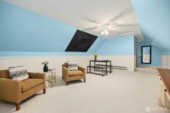 Don't miss the large bonus room located off the hallway to the primary bedroom. Vaulted ceilings and lots of room for crafts, media room, home office or gym. The black area is a chalk paint to keep track of your projects and crafts.