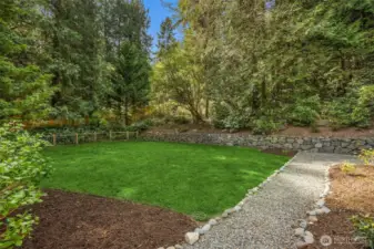 Not only is there an entertaining deck, but there is also a large grass play and garden area which is fully fenced. The mature landscaping provides great privacy.