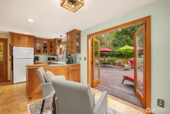 The sitting rom off the kitchen has double glass doors leading out the amazing deck.