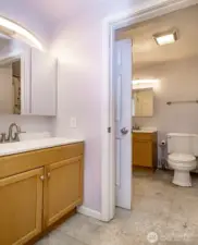 Primary bedroom half bath looking to main bath