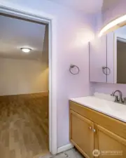 Primary bedroom half bath looking to bedroom.