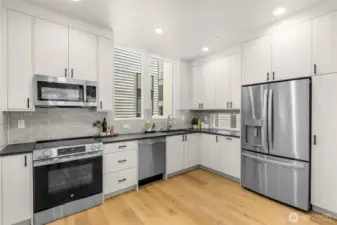 Gourmet kitchen with quartz counters, high-end appliances, and custom cabinetry.