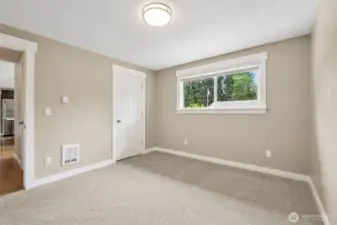 A look at bedroom #3's closet (it is a walk in). Any one of these rooms can also be used as an office (septic only rated for 3 bedroom house but all rooms have closets).