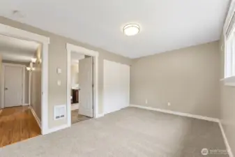 Another look at the primary bedroom with private bathroom.
