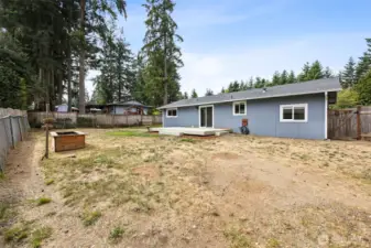 This yard is perfect for entertaining and there is so much room for activities/gardening/BBQ's you name it! (Flower box has since been removed)