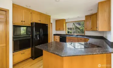 Kitchen with granite breakfast bar.