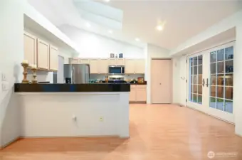 Kitchen with sitting bar.