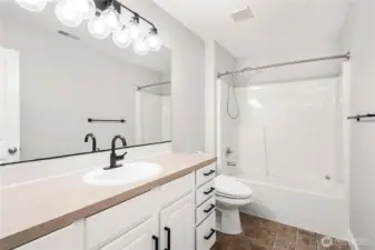 Upstairs guest bathroom with tub