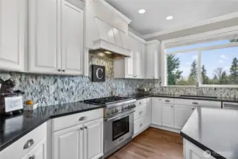 Gourmet kitchen opens into family room & built-in wine bar